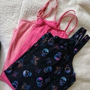 Pink and Black Bodysuits with Sleek Design and Edgy Patterns